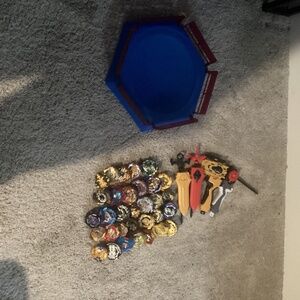 pack of 32 Beyblade‘s along with four ripchords plus extra pieces